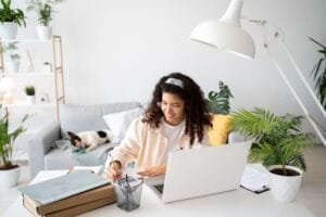 A woman working from home on a desk