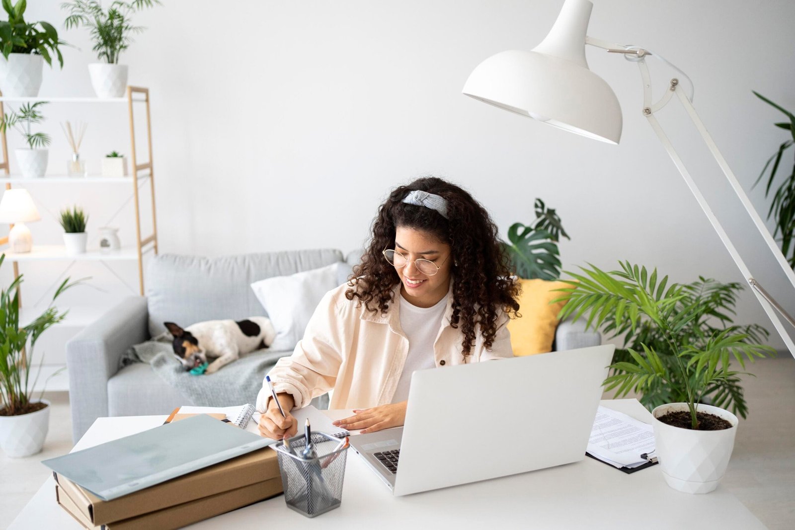 A woman working from home on a desk